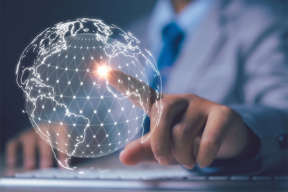 a person touching a globe