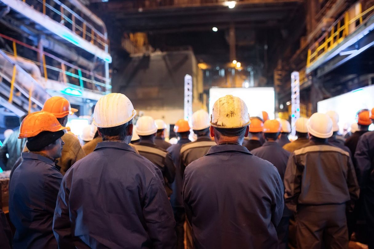 group of workers in a factory on minimum wage by country
