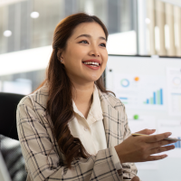 female asian accountant in discussion with a client