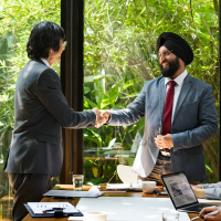 asian businessmen shaking hands