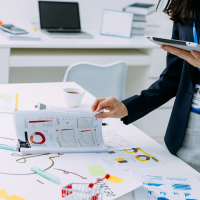 Businesswoman checking documents of financial data