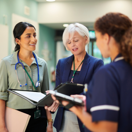 Female medical hospital staff in conversation