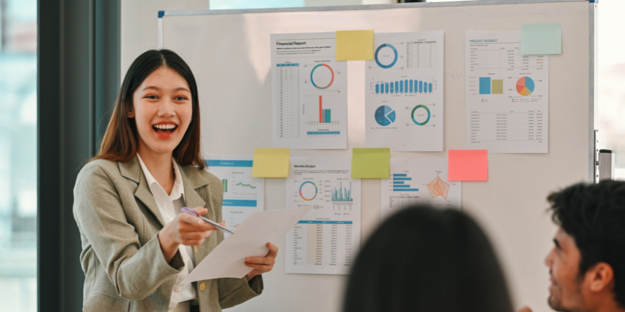asian businesswoman leading a meeting, discussing data