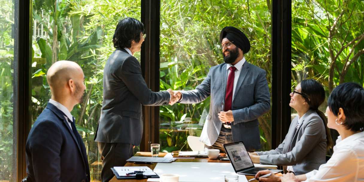 asian businessmen shaking hands