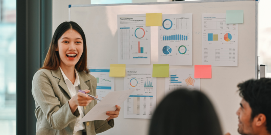 asian businesswoman leading a meeting, discussing data