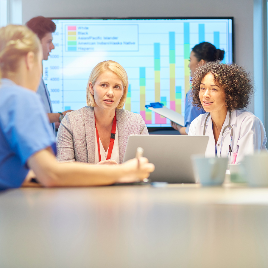 A mixed group of healthcare professionals in a meeting