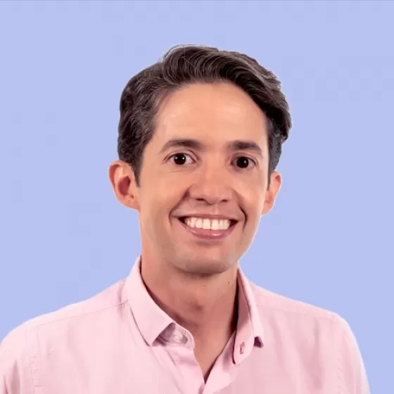 Jaime Bustamante Headshot with Mauve Background 