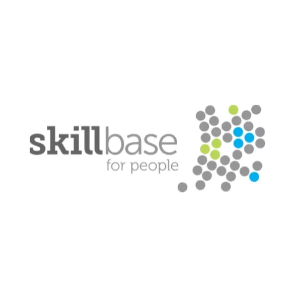 A series of grey, blue, and green dots formed a curved shape, alongside the word 'Skillbase for people'