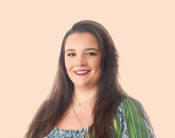 Grace Stoner Headshot with Peach Background