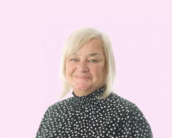 Karen Lilley headshot with Pink Background