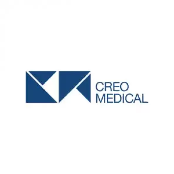 A stack of navy and white triangles, alongside the words 'Creo Medical'
